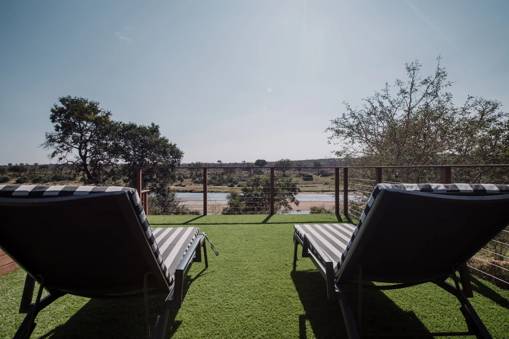 Two deck chairs in the sun.