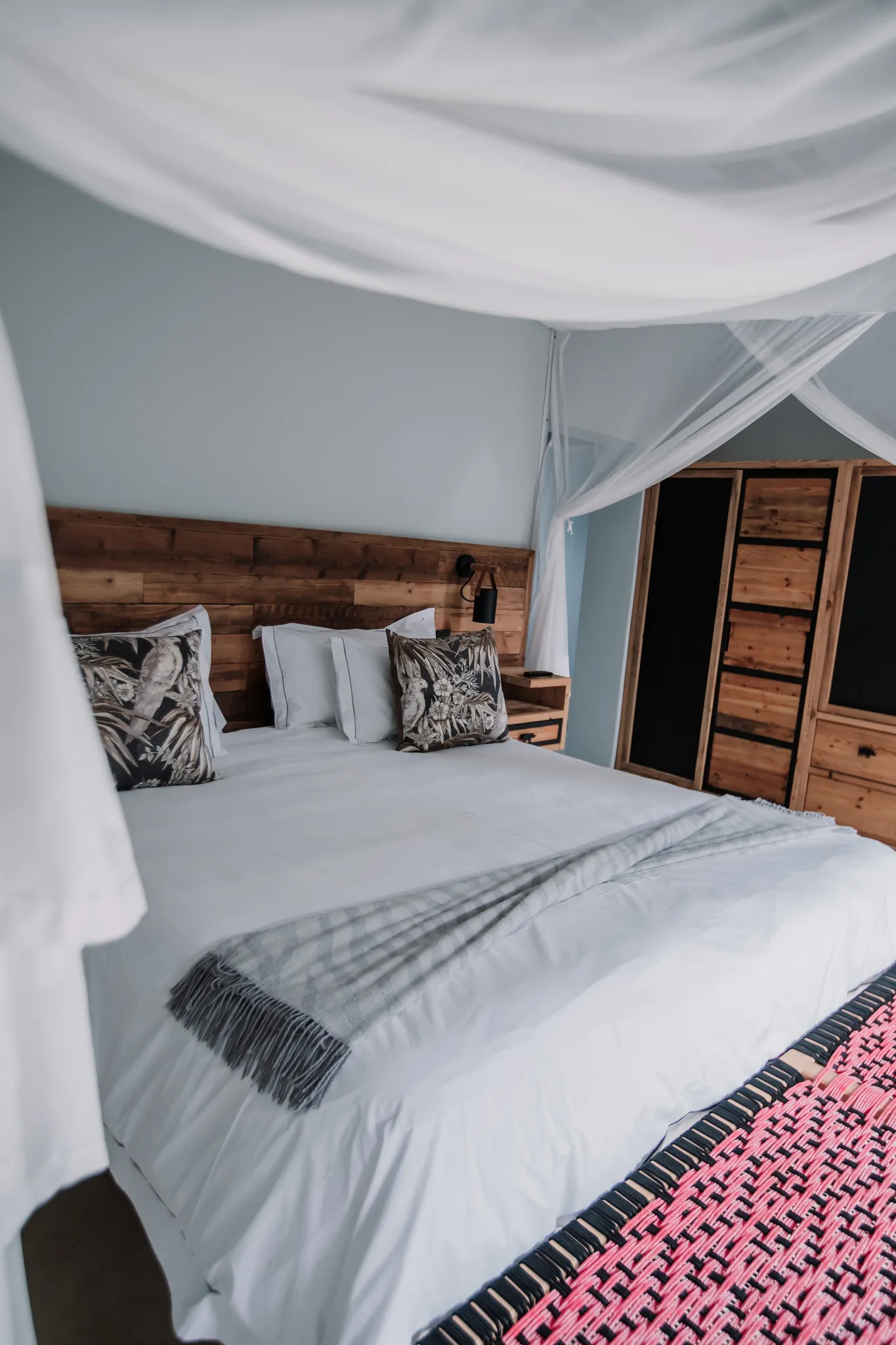 An elegant, white canopy bed.